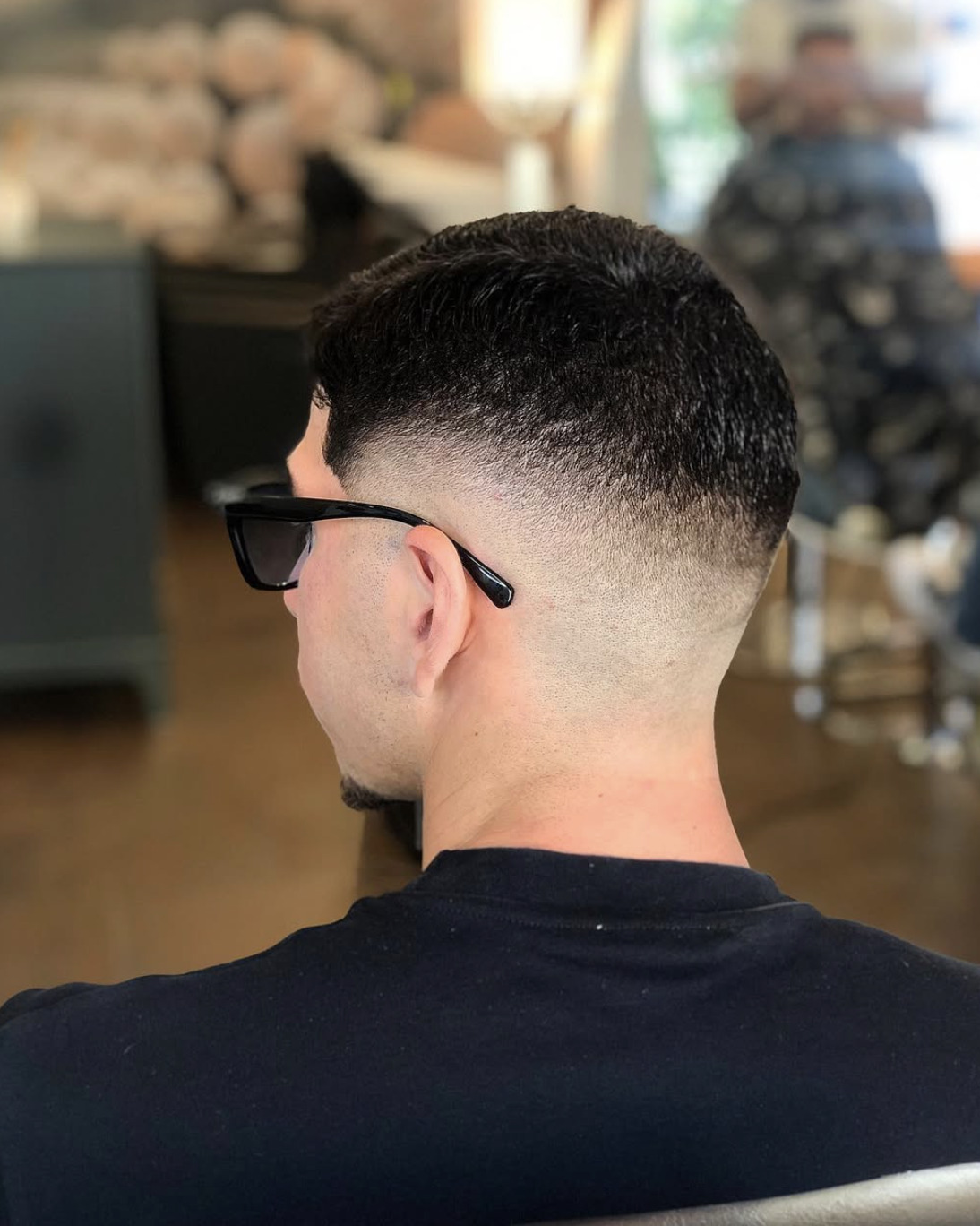 Rear view of a men's short haircut with a sharp skin fade at Hair Studio Frizerie in Bergamo.
