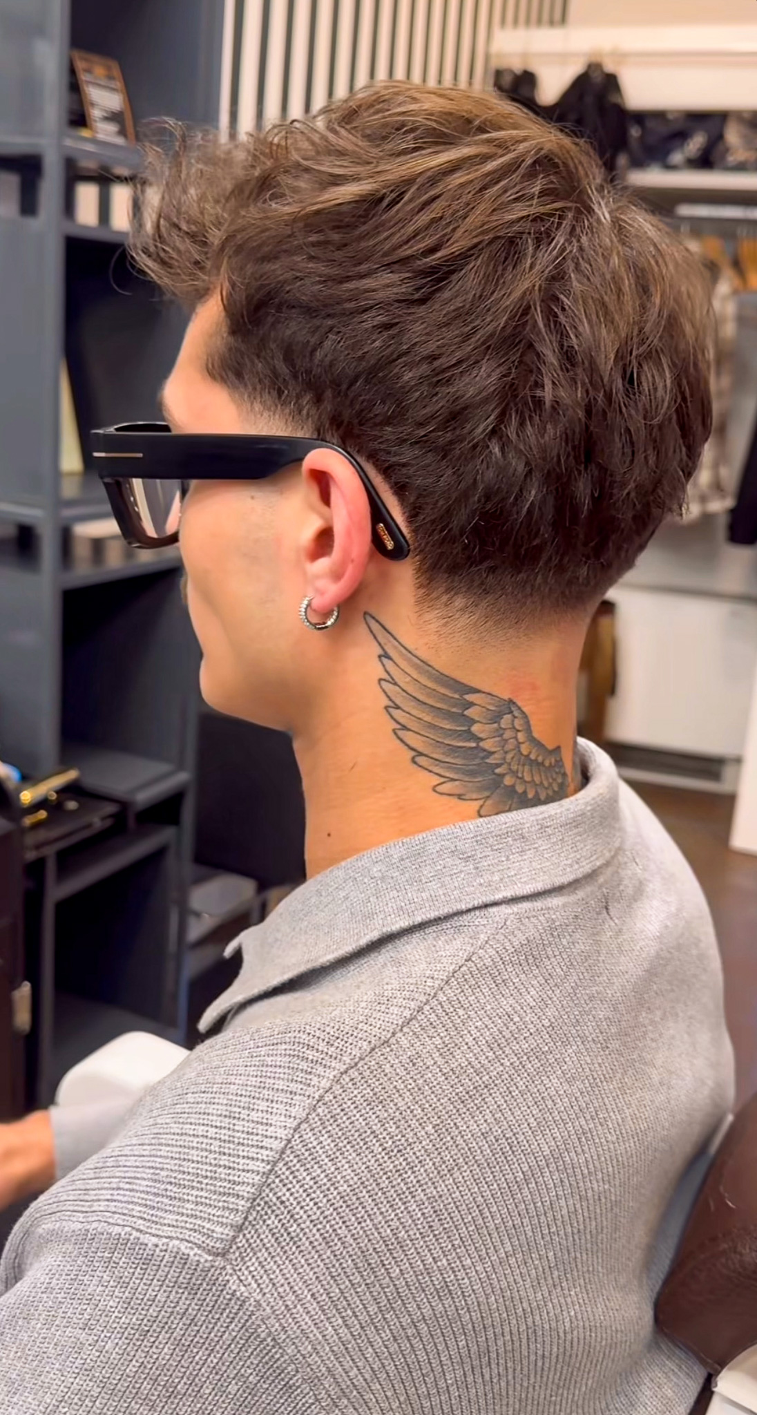 Modern textured men's haircut with a clean neck taper at Hair Studio Frizerie in Bergamo.